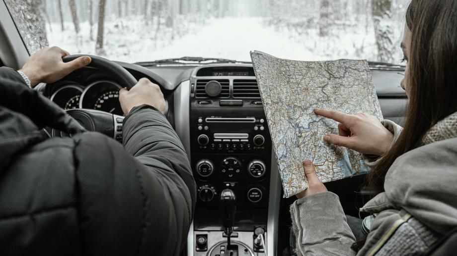 Smartphone GPS navigation showing route during winter road trip