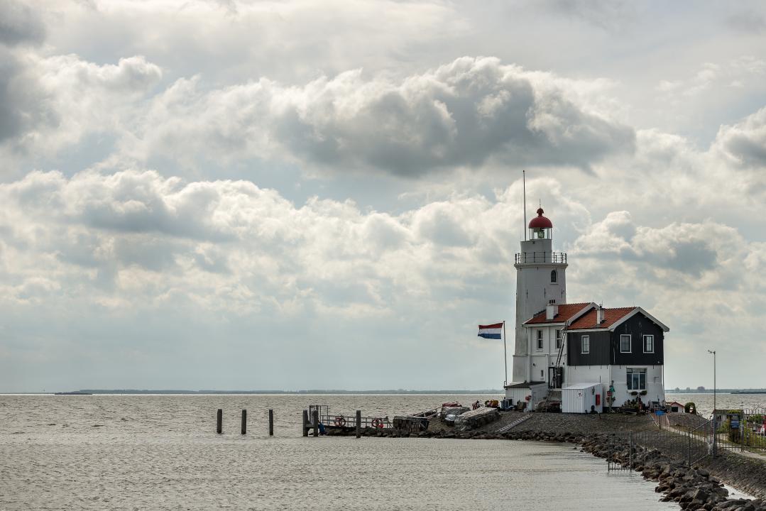 Scenic lighthouse on the coast of Newport, Rhode Island, offering quiet ocean views in late fall.