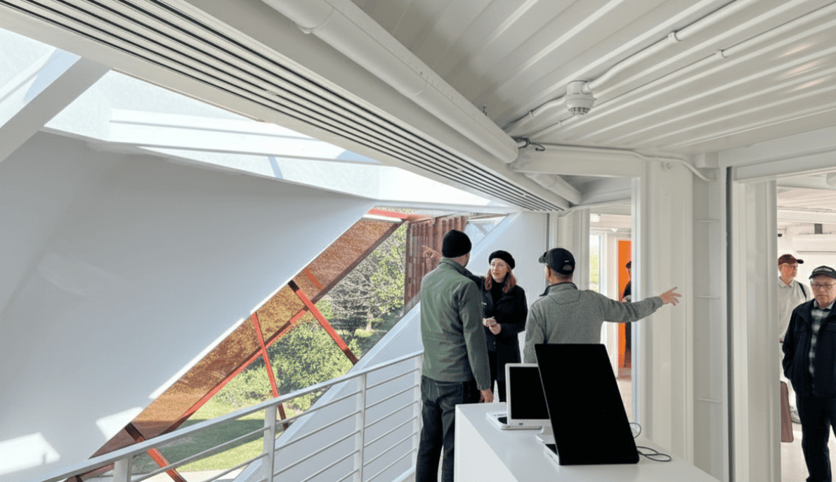 Visitors on an Archtober 2025 'Building of the Day' tour exploring a modern architectural space in NYC.