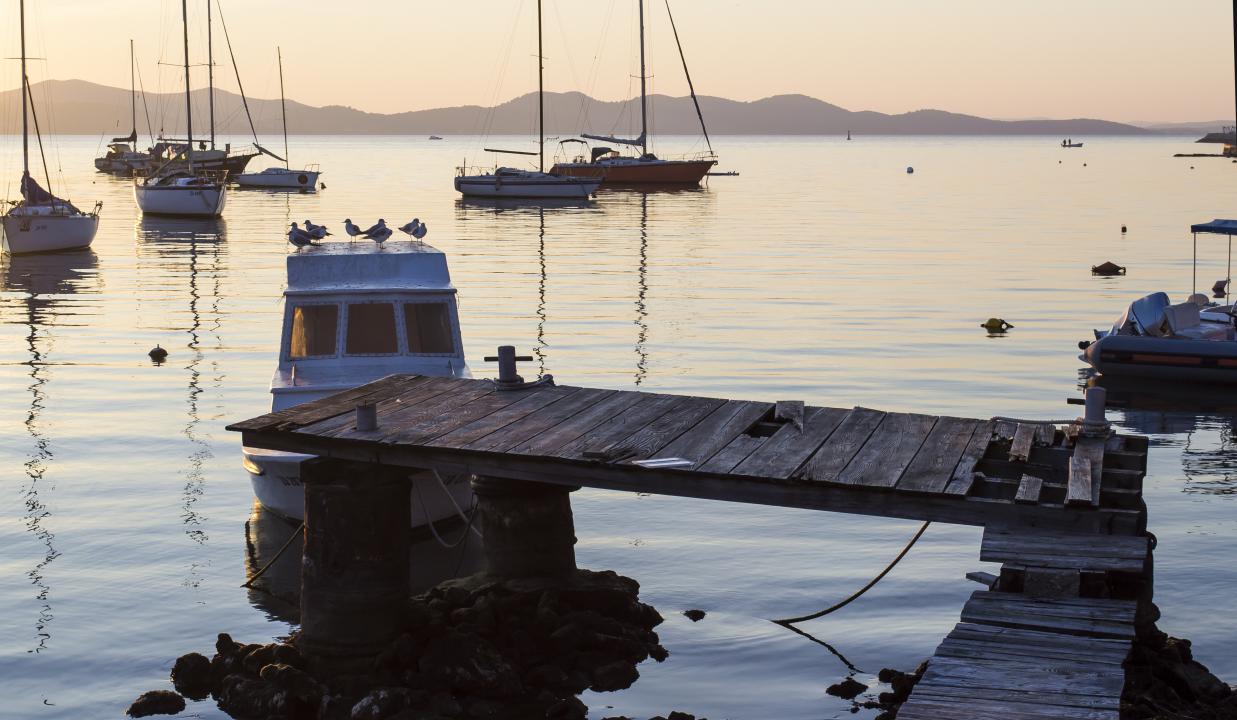 Calm harbor with boats in Rockport, Cape Ann, a quiet coastal destination for Thanksgiving.