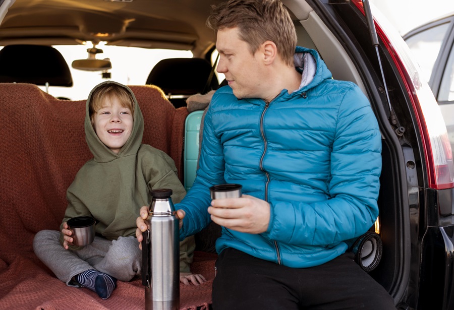 A boy in a baby seat